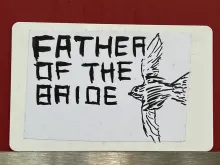 Father of the Bride with a bird drawn on it